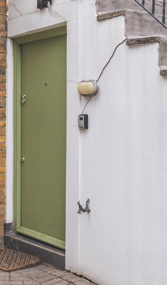 The flat's green front door